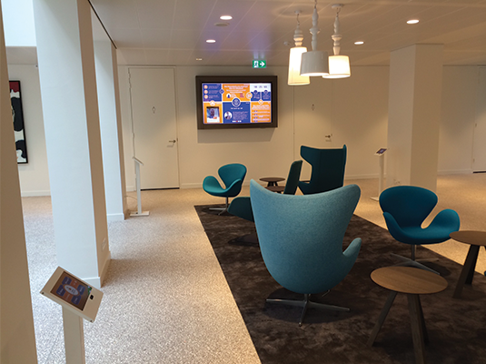 A Brickz.tv powered
                            Rabobank lobby with a big screen and several tablets